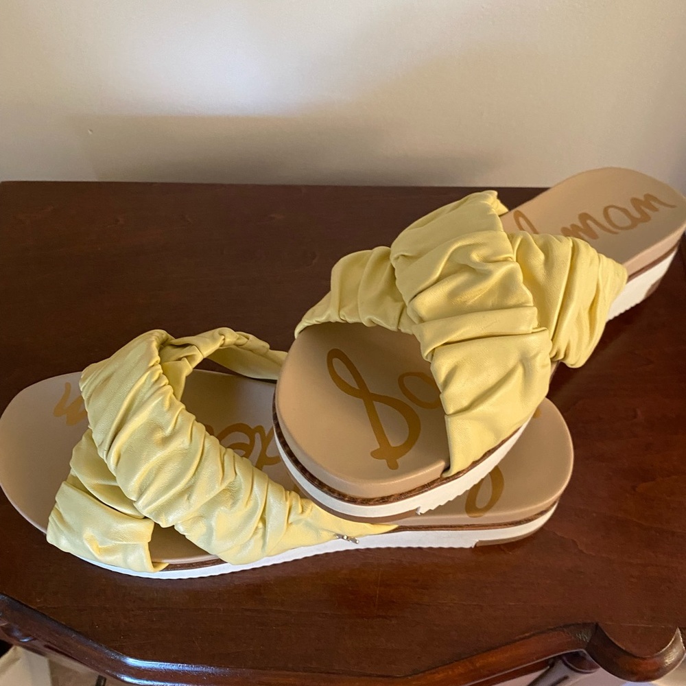 Cute ruffle leather, butter yellow slides. New without box.